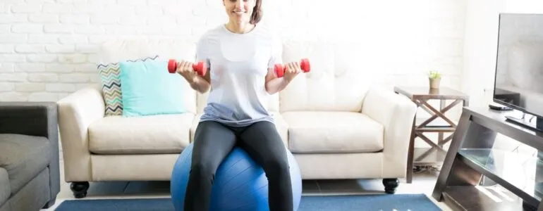 Woman exercising in living room