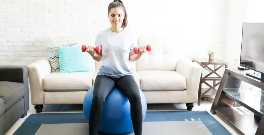 Woman exercising in living room